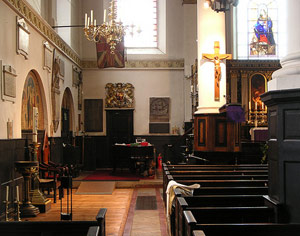 a vibrant house of God throngs with densely packed members of the flock