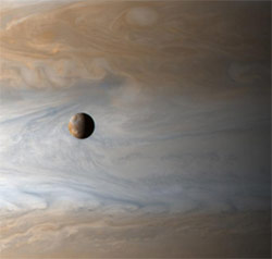 One of Jupiter's moons, Io, glides smoothly and serenely past its mother planet on its silent lonely orbit - sadly I have as yet received no emails from this staggeringly beautiful place